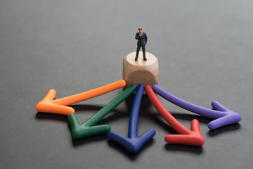 Career or opportunity choices for work, business decision concept, miniature businessman or salary...