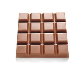 Tasty milk chocolate bar on white background