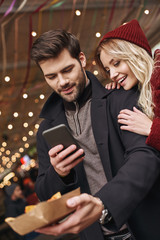 Couple taking pictures of mexican food. The concept of Mexican cuisine.