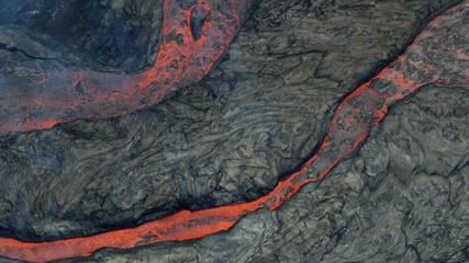 Aerial view of cooling natural red hot lava