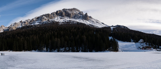 4 january 2019 (Misurina, Italy) landscape of the iced Misurina lake. On the background the Col de Varda Chairlift and ski run