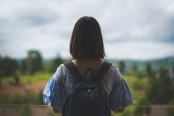 Happy young cute asian Japanese girl hipster backpack  women travelling looking at beautiful sky mountains scenery views 