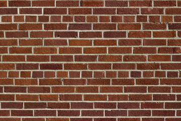 Obraz premium Grungy vintage reddish brown brick wall in common bond pattern