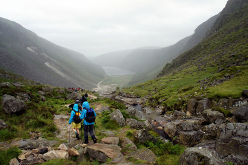 Fototapeta premium A group of tourists in the valley of Glendalough.