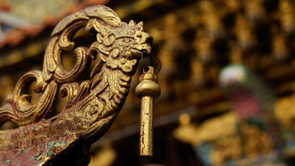 Chinese style gold Bas-relief of swan, dragon, lion in a chinese temple and have some space for write wording, unique style of chinese art that reflect culture, believe and respectful of people 