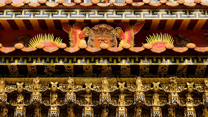 Chinese style gold Bas-relief of swan, dragon, lion in a chinese temple and have some space for write wording, unique style of chinese art that reflect culture, believe and respectful of people 