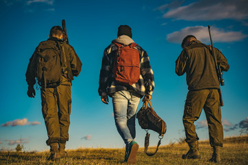 Hunters with shotgun gun on hunt. Hunting in Russia.