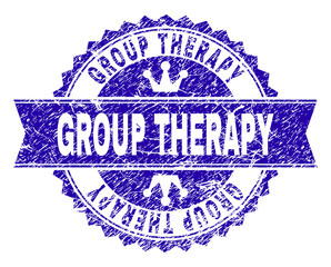 GROUP THERAPY rosette stamp overlay with grunge style. Designed with round rosette, ribbon and small crowns. Blue vector rubber watermark of GROUP THERAPY text with dirty style.