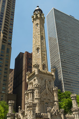 Fototapeta na wymiar Chicago Avenue Water Tower and Pumping Station with downtown in background. Chicago, Illinois, U.S.A..