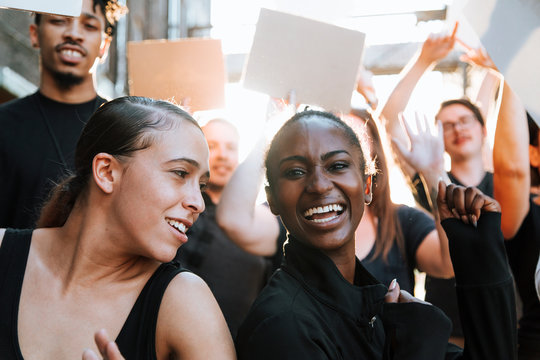 Happy Activists Marching Through The City