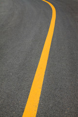 Yellow line on the asphalt road