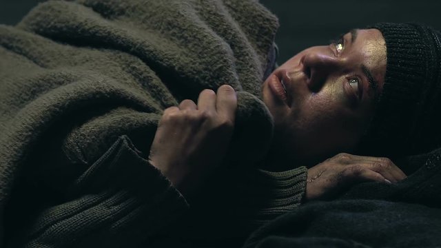 Homeless listening to bombing, hiding in shelter, war victim dreaming of peace