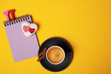 cup of coffee and notebook for the letter