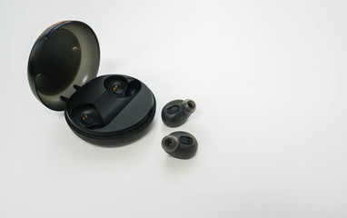 Obraz na płótnie Canvas isolated modren portable wireless bluetooth earbuds with trendy case