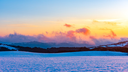 Obraz premium Amazing beautiful vibrant winter sunset in the mountains