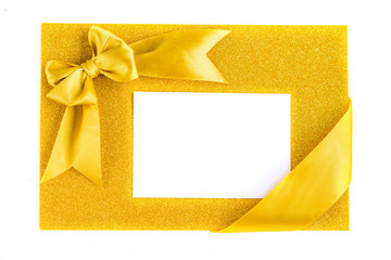 Golden ribbon bow on glitter Golden half white on the diagonal background. Festive background with...