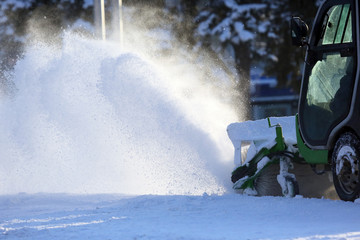 Special snow machine clears snow on the city street