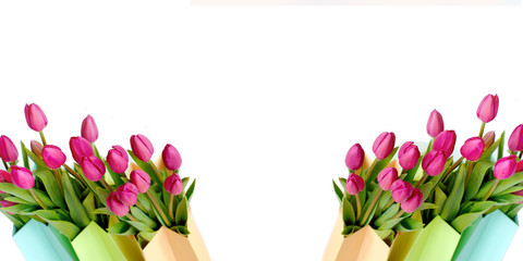 Fresh bright bouquet of pink tulip in paper bags. Beautiful greeting card. Spring Holidays concept. Copyspace.