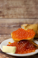 baguette sandwich with red caviar and butter.