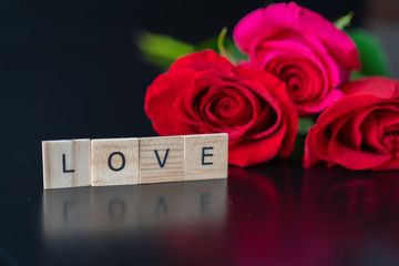 Fototapeta premium fresh cut roses for valantines day - Romantic Concept on black background