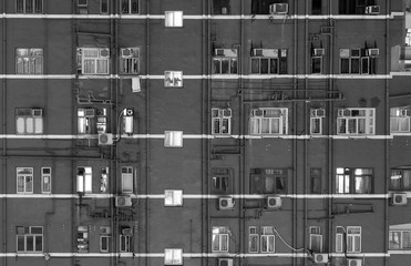 Exterior of colorful residential building in Hong Kong city at night