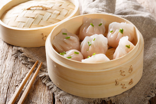 Steamed shrimp dumplings dim sum  close-up on the table. horizontal