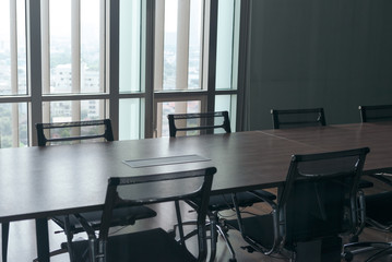 Fototapeta premium Table and chairs in office meeting room. empty conference room.