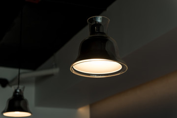 modern lamp hanging from the ceiling with copy space. Dark Tone