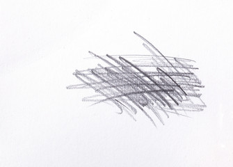 multiple linear pencil scratches on blank paper surface.