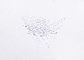 multiple linear pencil scratches on blank paper surface.