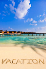 Word Vacation on beach