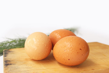 egg on a cutting board isolated on white 