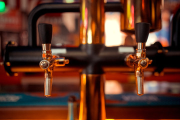 Fototapeta na wymiar Beer tap array amber