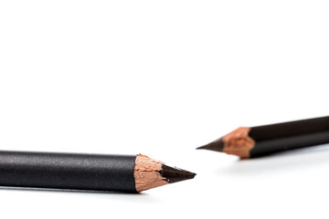 Black pencil for eyes. Realistic eyeliner with cap. Decorative cosmetic product - liner for beautiful makeup, on white background.