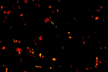 flame of fire with sparks black background