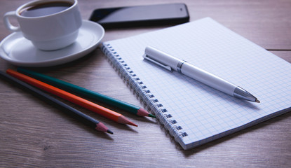 notebook pen smartphone coffee