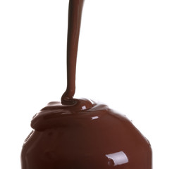 Pouring of melted chocolate on white background