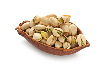 Cocoa pod with tasty pistachio nuts on white background