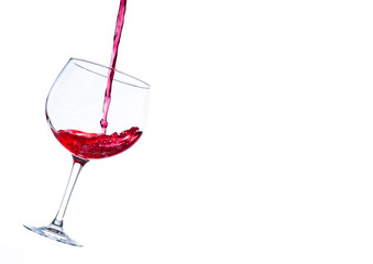 liquid splashing into a cocktail glass on a white background