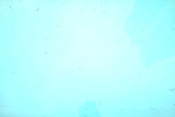 Blurred water surface with blue color of a dirty pool for background texture 