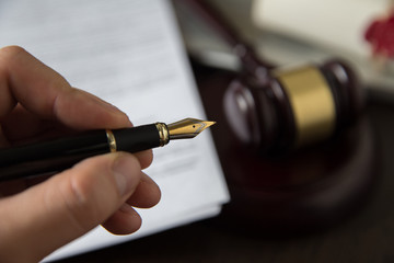 Notary's public pen and stamp on testament and last will. Notary public tools
