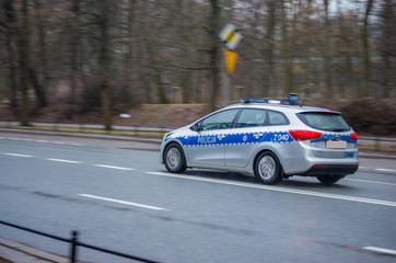 Police car travelling on the road at high speed