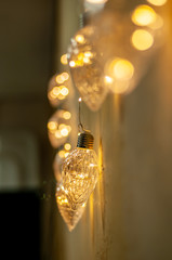 Hanging light bulb over the wooden background, mockup poster. Background wood planks with lamps