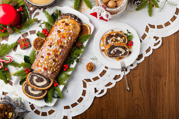 Poppy seed roulade in Christmas decoration. Served with coffee or tea.