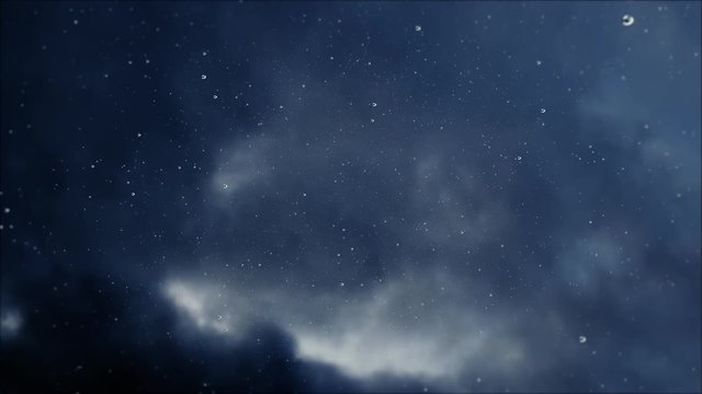 Raindrops falling in slowmotion from the storm clouds