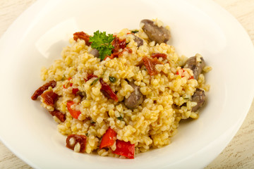 Bulgur with chicken hearts