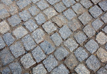 Old pedestrian road paved with granite stones