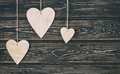 Wood heart on wood background