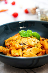 Penne gratin with vegetables, grilled zucchini and marinated tomatoes