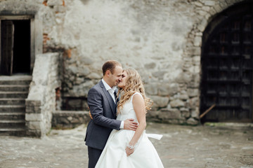 Wedding couple. Pretty bride and stylish groom.